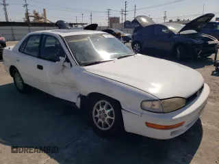 1992 Toyota Camry LE with VIN 4T1SK12E0NU077223, listed as a Copart auction lot 71787194 with 239,027 mi miles and Salvage Title. Bid and sale history available at carsss.com. Image 4.