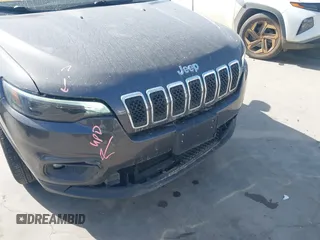 2019 Jeep Cherokee Latitude Plus with VIN 1C4PJLLB0KD382309, listed as a IAAI auction lot 41812968 with 144,368 mi miles. Bid and sale history available at carsss.com. Image 6.