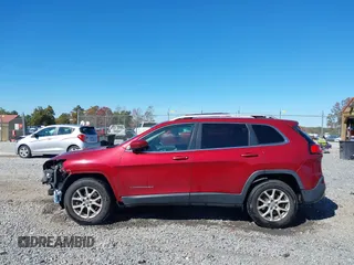 2016 Jeep Cherokee Latitude with VIN 1C4PJMCB2GW153972, listed as a IAAI auction lot 40579489 with 130,176 mi miles. Bid and sale history available at carsss.com. Image 14.