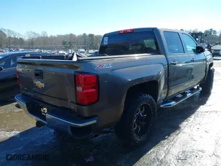 2015 Chevrolet Silverado 1500 LT with VIN 3GCUKREC9FG517787, listed as a IAAI auction lot 41400803 with 254,489 mi miles. Bid and sale history available at carsss.com. Image 4.