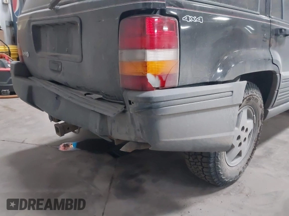 1995 Jeep Grand Cherokee Laredo with VIN 1J4GZ58S6SC765863, listed as a IAAI auction lot 41797726 with 234,715 mi miles and . Bid and sale history available at DreamBid. Image 6.