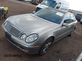 2004 Mercedes-Benz E-Class 5.0L with VIN WDBUF70J14A522118, listed as a IAAI auction lot 41786440 with 153,325 mi miles. Bid and sale history available at carsss.com. Image 2.