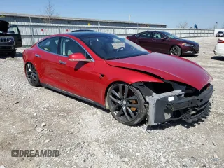 2014 Tesla Model S 60 with VIN 5YJSA1S12EFP65799, listed as a Copart auction lot 50895235 with 132,669 mi miles and Salvage Title. Bid and sale history available at DreamBid. Image 4.
