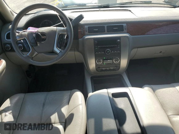 2007 GMC Yukon SLT with VIN 1GKFK13057J345796, listed as a Copart auction lot 71773124 with 218,788 mi miles and Salvage Title. Bid and sale history available at DreamBid. Image 8.