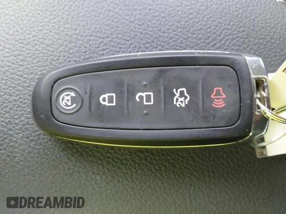 2015 Ford Escape Titanium with VIN 1FMCU0J98FUC07196, listed as a IAAI auction lot 41930660 with 51,161 mi miles and . Bid and sale history available at DreamBid. Image 11.