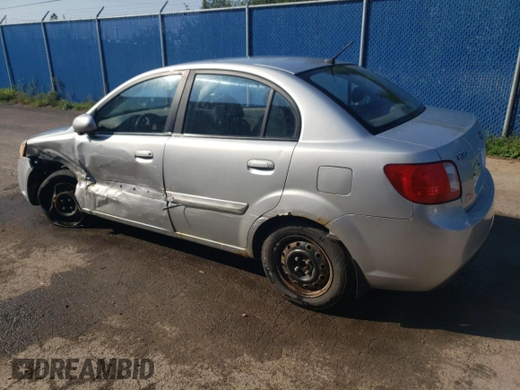2011 Kia Rio with VIN KNADH4B32B6915275, listed as a Copart auction lot 71546484 with 297,998 mi miles and Salvage Title. Bid and sale history available at DreamBid. Image 2.