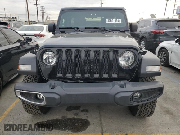 2022 Jeep Wrangler Unlimited High Tide with VIN 1C4HJXDG4NW179888, listed as a Copart auction lot 82601624 with 15,631 mi miles and Salvage Title. Bid and sale history available at DreamBid. Image 5.