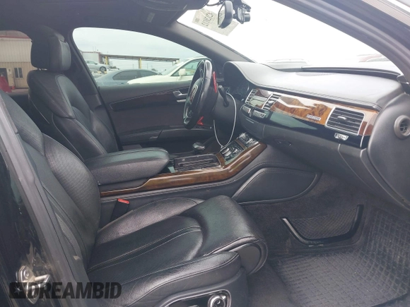 2015 Audi A8 L 4.0T with VIN WAU32AFD4FN033471, listed as a IAAI auction lot 42120112 with 174,882 mi miles. Bid and sale history available at carsss.com. Image 5.