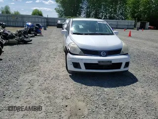 2007 Nissan Versa SL z VIN 3N1BC13E07L387968, wystawiony jako Copart lot #56212805 z przebiegiem 223 651 mil mil oraz Szkoda całkowita • Salvage title. Historia ofert i sprzedaży dostępna na DreamBid. Obrazek 14.