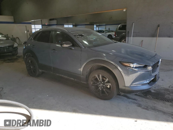 2022 Mazda CX-30 S Carbon Edition с VIN 3MVDMBCL7NM429131, выставлен на аукционе Copart как лот 42421695 с пробегом 21 825 миль миль и Списание • Salvage title. История ставок и продаж доступна на DreamBid. Изображение 4.