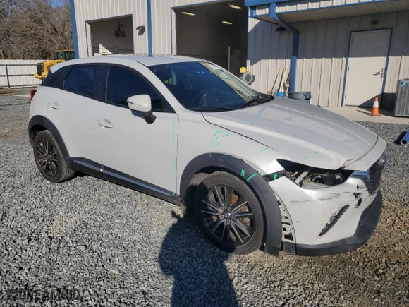 2016 Mazda CX-3 Grand Touring with VIN JM1DKBD70G0106540, listed as a Copart auction lot 45001355 with 233,341 mi miles and Salvage Title. Bid and sale history available at carsss.com. Image 4.