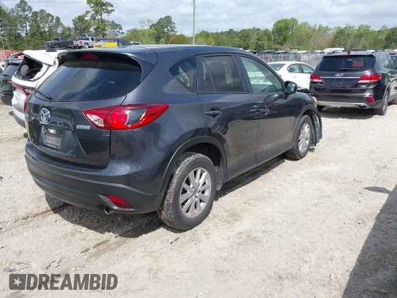 2016 Mazda CX-5 Touring with VIN JM3KE2CYXG0647921, listed as a IAAI auction lot 41948068 with 133,733 mi miles and . Bid and sale history available at DreamBid. Image 4.