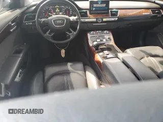 2014 Audi A8 3.0T z VIN WAURGAFD5EN007438, wystawiony jako Copart lot #47979945 z przebiegiem 147 236 mil mil oraz Szkody całkowita. Historia ofert i sprzedaży dostępna na DreamBid. Obrazek 8.