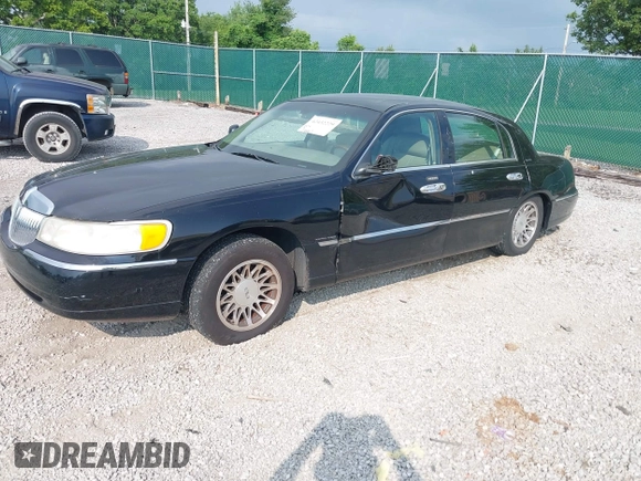 2001 Lincoln Town Car Signature with VIN 1LNHM82W11Y613959, listed as a IAAI auction lot 42432229 with 144,660 mi miles and . Bid and sale history available at DreamBid. Image 2.