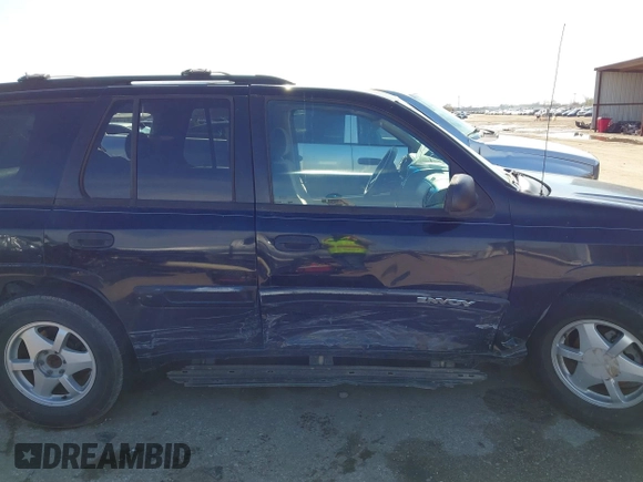 2003 GMC Envoy SLE with VIN 1GKDS13S732134354, listed as a IAAI auction lot 41305506 with 221,733 mi miles. Bid and sale history available at carsss.com. Image 13.