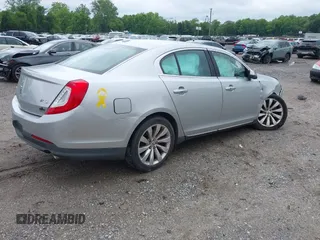 2013 Lincoln MKS with VIN 1LNHL9DK4DG606551, listed as a IAAI auction lot 42343140 with 70,424 mi miles and . Bid and sale history available at DreamBid. Image 4.