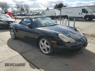 2000 Porsche Boxster z VIN WP0CA2988YU627807, wystawiony jako Copart lot #45522955 z przebiegiem 120 384 mil mil oraz Szkody całkowita. Historia ofert i sprzedaży dostępna na DreamBid. Obrazek 4.