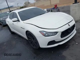 2014 Maserati Ghibli S Q4 z VIN ZAM57RTA3E1090350, wystawiony jako IAAI lot #42056682 z przebiegiem 119 160 mil mil oraz . Historia ofert i sprzedaży dostępna na DreamBid. Obrazek 1.