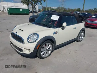 2013 MINI Convertible S with VIN WMWZP3C51DT297843, listed as a IAAI auction lot 41527353 with 127,827 mi miles and . Bid and sale history available at DreamBid. Image 2.
