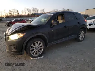 2014 Mazda CX-5 Grand Touring with VIN JM3KE4DY9E0366667, listed as a Copart auction lot 88707365 with 140,115 mi miles and Salvage Title. Bid and sale history available at carsss.com. Image 1.