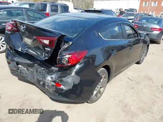 2018 Mazda 3 Touring with VIN 3MZBN1V34JM261565, listed as a IAAI auction lot 41795238 with 121,112 mi miles. Bid and sale history available at carsss.com. Image 4.