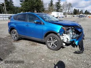 2018 Toyota RAV4 XLE with VIN 2T3RFREV3JW752934, listed as a Copart auction lot 48942015 with 74,182 mi miles and Salvage Title. Bid and sale history available at DreamBid. Image 4.