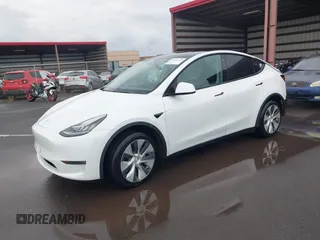 2020 Tesla Model Y Long Range z VIN 5YJYGDEE3LF043800, wystawiony jako IAAI lot #41590220 z przebiegiem 62 341 mil mil oraz . Historia ofert i sprzedaży dostępna na DreamBid. Obrazek 2.