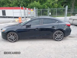 2018 Mazda 3 Touring z VIN 3MZBN1V36JM202498, wystawiony jako IAAI lot #42380709 z przebiegiem 108 930 mil mil oraz . Historia ofert i sprzedaży dostępna na DreamBid. Obrazek 14.