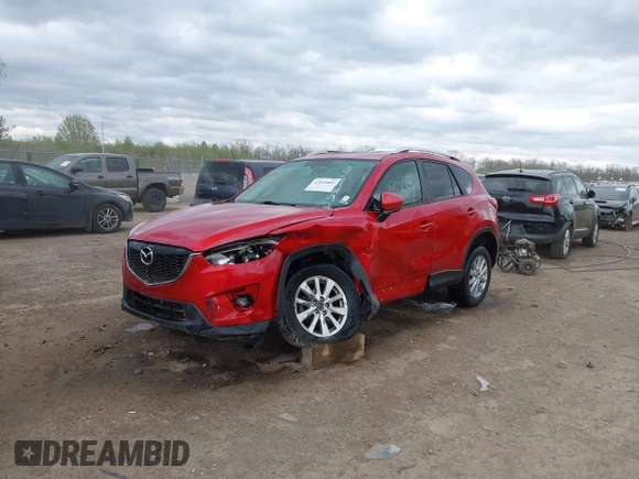 2014 Mazda CX-5 Touring z VIN JM3KE2CY3E0424892, wystawiony jako IAAI lot #42016801 z przebiegiem 173 350 mil mil oraz . Historia ofert i sprzedaży dostępna na DreamBid. Obrazek 18.