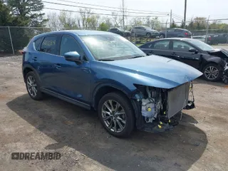 2019 Mazda CX-5 Signature with VIN JM3KFBEY1K0512880, listed as a IAAI auction lot 42036904 with 92,650 mi miles. Bid and sale history available at carsss.com. Image 1.