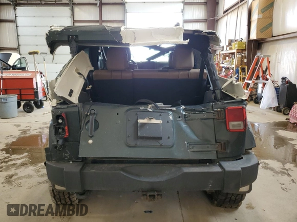 2012 Jeep Wrangler Unlimited Rubicon with VIN 1C4HJWFG4CL119390, listed as a Copart auction lot 60026425 with 305,189 mi miles and Salvage title. Bid and sale history available at DreamBid. Image 6.