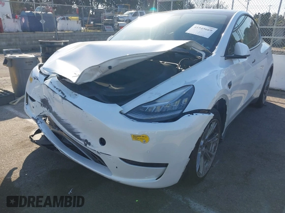 2022 Tesla Model Y Long Range z VIN 7SAYGDEE8NF374636, wystawiony jako IAAI lot #41545669 z przebiegiem 41 965 mil mil oraz . Historia ofert i sprzedaży dostępna na DreamBid. Obrazek 19.
