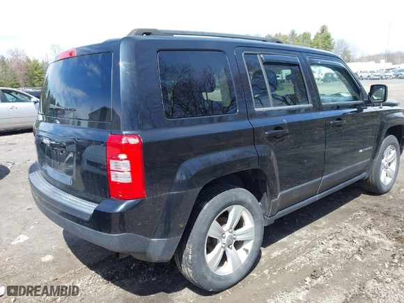 2014 Jeep Patriot Sport with VIN 1C4NJRBB1ED811019, listed as a IAAI auction lot 42039895 with 124,837 mi miles. Bid and sale history available at carsss.com. Image 4.