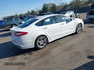 2015 Ford Fusion SE Hybrid with VIN 3FA6P0LU3FR249444, listed as a IAAI auction lot 41602659 with 145,024 mi miles. Bid and sale history available at carsss.com. Image 4.