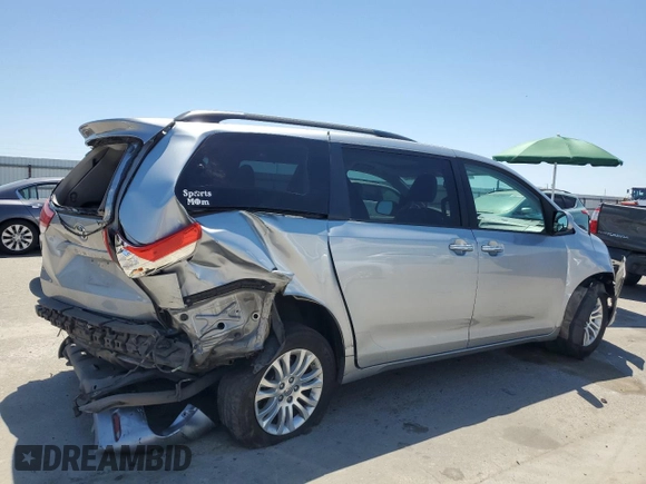 2014 Toyota Sienna XLE with VIN 5TDYK3DCXES496657, listed as a Copart auction lot 60498015 with 178,486 mi miles and Salvage title. Bid and sale history available at DreamBid. Image 3.