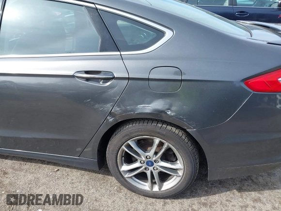 2015 Ford Fusion Energi Titanium with VIN 3FA6P0SU0FR200963, listed as a IAAI auction lot 41897182 with 104,100 mi miles. Bid and sale history available at carsss.com. Image 12.