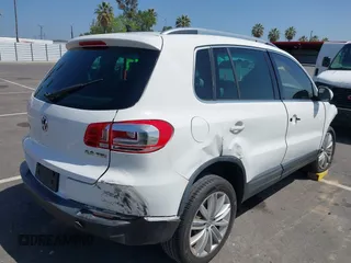 2014 Volkswagen Tiguan SEL with VIN WVGAV3AX9EW512956, listed as a IAAI auction lot 42110002 with 136,034 mi miles and . Bid and sale history available at DreamBid. Image 4.