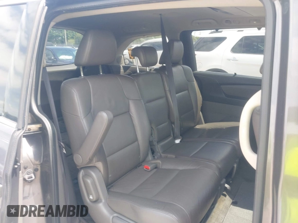 2012 Honda Odyssey Touring with VIN 5FNRL5H90CB088536, listed as a IAAI auction lot 42102008 with 283,350 mi miles and . Bid and sale history available at DreamBid. Image 8.