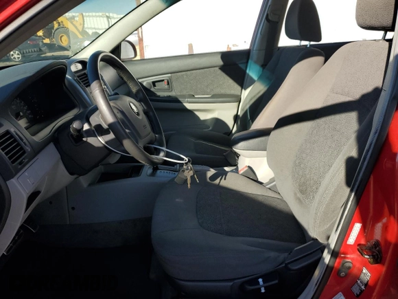 2005 Kia Spectra with VIN KNAFE161455146328, listed as a Copart auction lot 77605534 with 110,605 mi miles and Salvage Title. Bid and sale history available at DreamBid. Image 7.