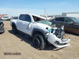 2020 Toyota Tacoma SR5 with VIN 3TMCZ5ANXLM297886, listed as a IAAI auction lot 41965591 with Not provided miles and . Bid and sale history available at DreamBid. Image 1.