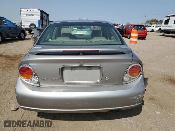 2002 Nissan Maxima GLE z VIN JN1DA31A62T000726, wystawiony jako Copart lot #71235864 z przebiegiem 219 647 mil mil oraz Szkoda całkowita • Salvage title. Historia ofert i sprzedaży dostępna na DreamBid. Obrazek 6.