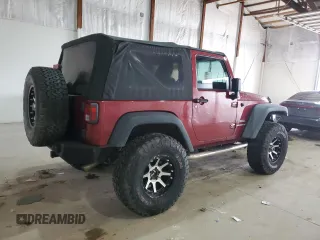 2012 Jeep Wrangler Sport with VIN 1C4AJWAG5CL233049, listed as a Copart auction lot 52328865 with 185,388 mi miles and Salvage title. Bid and sale history available at DreamBid. Image 3.
