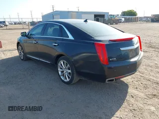 2014 Cadillac XTS Luxury with VIN 2G61M5S35E9228802, listed as a IAAI auction lot 42542501 with 106,506 mi miles and . Bid and sale history available at DreamBid. Image 3.