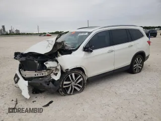 2017 Honda Pilot Touring z VIN 5FNYF5H95HB015365, wystawiony jako Copart lot #52371205 z przebiegiem 153 141 mil mil oraz Szkoda całkowita • Salvage title. Historia ofert i sprzedaży dostępna na DreamBid. Obrazek 1.