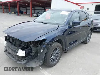 2020 Mazda CX-5 Touring with VIN JM3KFACM2L0856777, listed as a IAAI auction lot 42073972 with 151,628 mi miles. Bid and sale history available at carsss.com. Image 22.