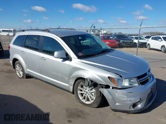 2013 Dodge Journey SXT with VIN 3C4PDDBG4DT506900, listed as a IAAI auction lot 42032379 with 130,911 mi miles and . Bid and sale history available at DreamBid. Image 1.