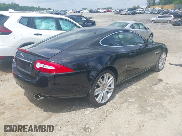 2012 Jaguar XK with VIN SAJWA4FB8CLB47049, listed as a IAAI auction lot 42118136 with 60,953 mi miles. Bid and sale history available at carsss.com. Image 4.