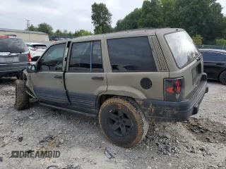 1996 Jeep Grand Cherokee Laredo with VIN 1J4GZ58S3TC297818, listed as a Copart auction lot 67712584 with 284,653 mi miles and Salvage Title. Bid and sale history available at carsss.com. Image 2.