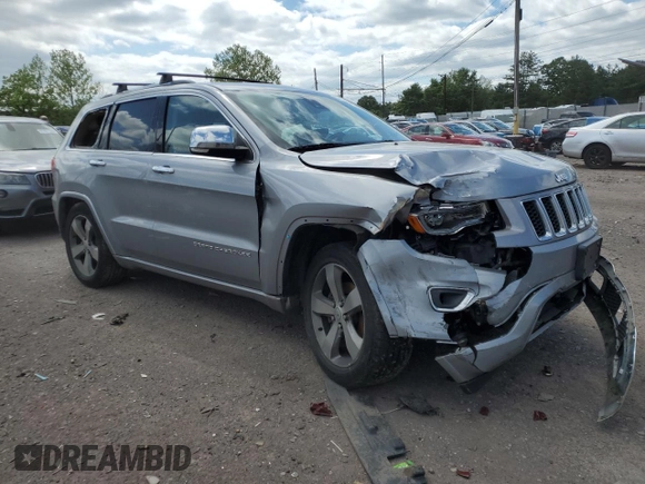 2015 Jeep Grand Cherokee Overland with VIN 1C4RJFCG3FC880084, listed as a Copart auction lot 57291165 with 112,442 mi miles and Salvage title. Bid and sale history available at DreamBid. Image 4.