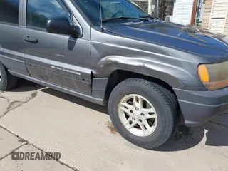 2003 Jeep Grand Cherokee Laredo with VIN 1J4GX48S53C504225, listed as a IAAI auction lot 41879669 with 247,246 mi miles. Bid and sale history available at carsss.com. Image 6.